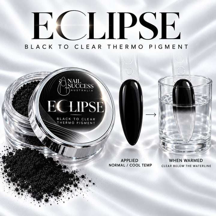 ECLIPSE silver pigment jar beside medium almond nail tips: applied pigment is glossy black at normal or cool temperature; warm water fades the submerged lower half to see-through while the upper half stays black.