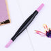 Double-ended pink stone cuticle remover and nail file tool with black easy-grip handle for manicure nail prep
