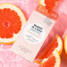 Voesh Mani in a Box Deluxe 3 Step Vitamin Recharge manicure kit with organic olive oil and vitamin C surrounded by grapefruit slices
