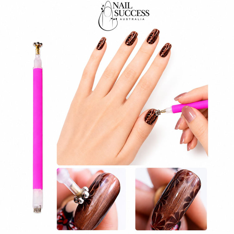 Double-ended pink cat-eye magnet pen creating textured web patterns in brown magnetic gel polish
