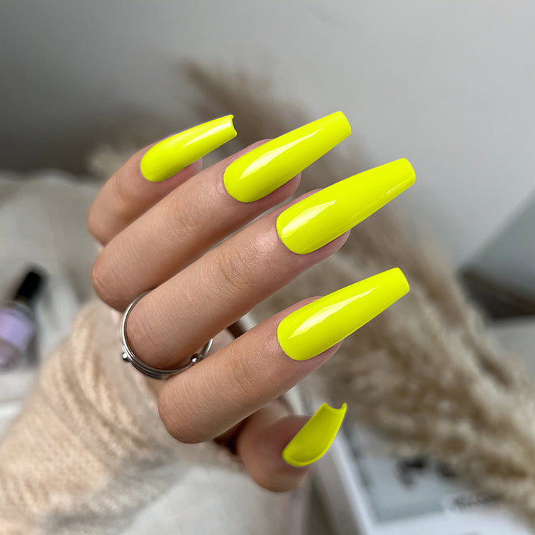 Nail Success Australia gel polish C049 in neon yellow, shown on a model's long glossy coffin nails
