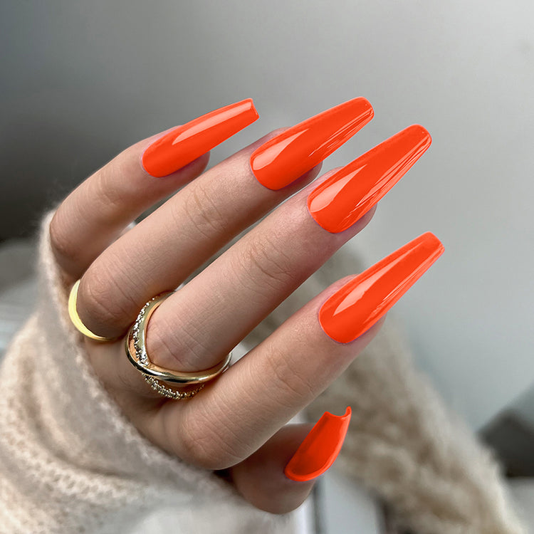 Nail Success Australia gel polish C050 in neon orange, shown on a model's long glossy coffin nails