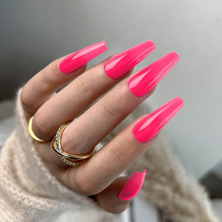 Nail Success Australia gel polish C052 in hot neon pink, shown on a model's long glossy coffin nails