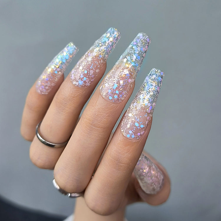 Nail Success Australia gel polish C055 in a clear base packed with iridescent opal glitter, shown on a model's long coffin nails in a sparkly ombre
