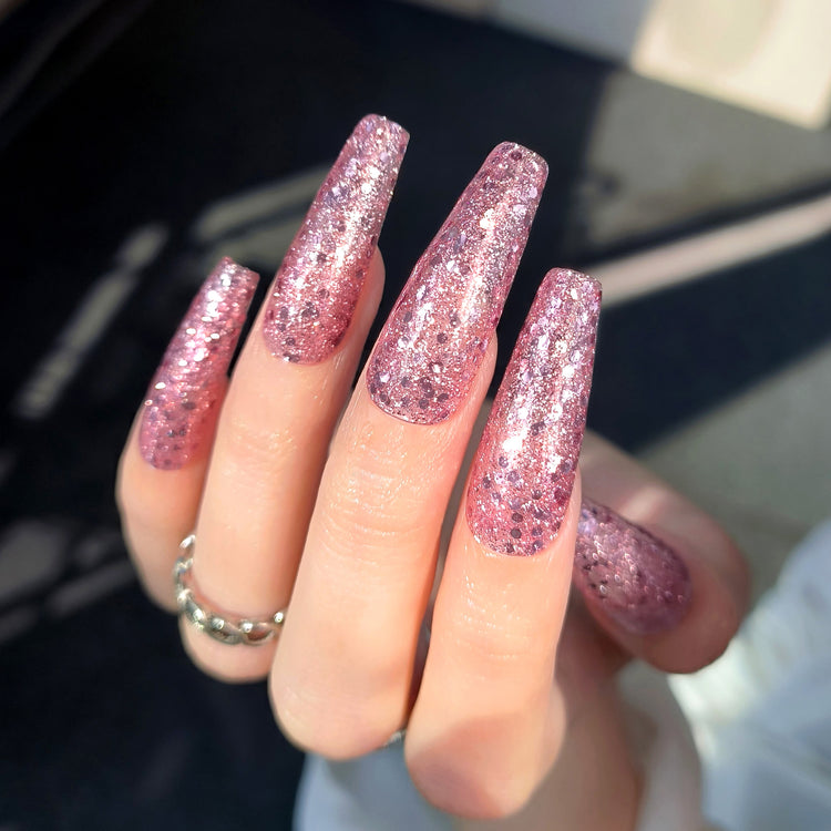 Nail Success Australia gel polish C058 in a pink glitter, shown on a model's long glossy coffin nails