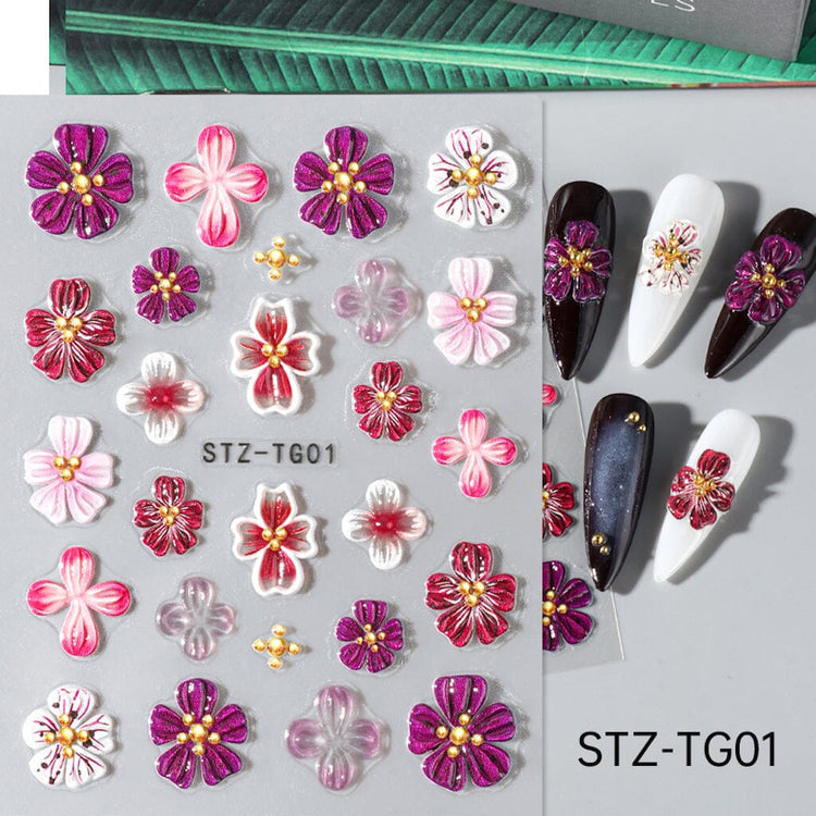 STZ-TG01 5D Embossed Orchid Flower Nail Art Sticker sheet with pink, purple, red and white floral designs on manicure samples