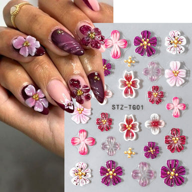 STZ-TG01 5D Embossed Orchid Flower Nail Art Sticker sheet with pink, purple and red floral designs on manicure sample