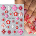 STZ-TG02 5D Embossed Orchid Flower Nail Art Sticker sheet with red, pink and clear floral designs on manicure sample