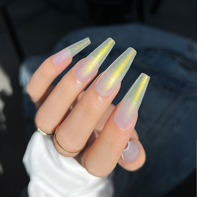 Nail Success Australia gel polish C065 in a milky white with golden aurora shimmer, shown on a model's long glossy coffin nails