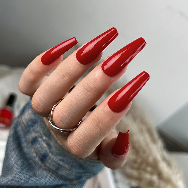 Nail Success Australia gel polish C070 in a classic true red, shown on a model's long glossy coffin nails