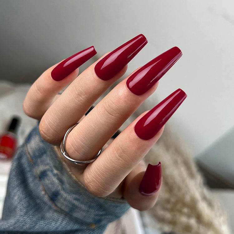 Nail Success Australia gel polish C071 in a deep wine red, shown on a model's long glossy coffin nails