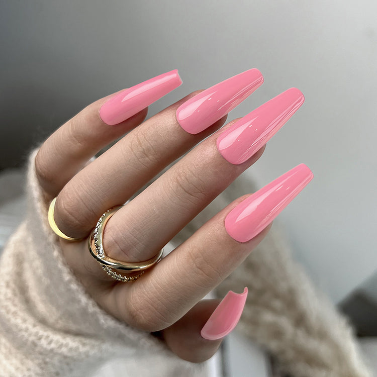 Nail Success Australia gel polish C082 in a coral salmon pink, shown on a model's long glossy coffin nails