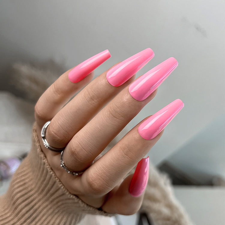 Nail Success Australia gel polish C085 in a bright candy pink, shown on a model's long glossy coffin nails