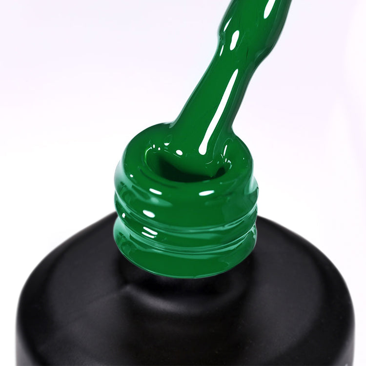 Nail Success Australia gel polish C047 in rich kelly green, a close-up of the brush lifting from the bottle neck showing the creamy green colour