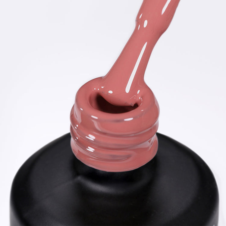 Nail Success Australia gel polish C078 in a dusty rose mauve pink, a close-up of the brush lifting from the bottle neck showing the creamy colour
