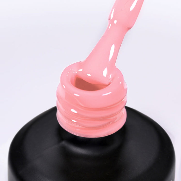 Nail Success Australia gel polish C079 in a soft baby pink, a close-up of the brush lifting from the bottle neck showing the creamy colour