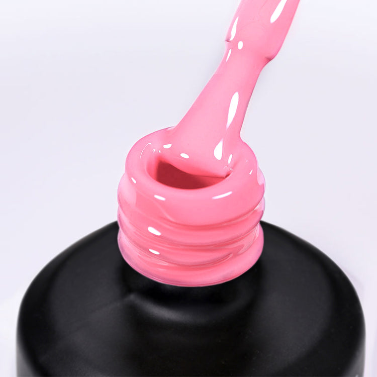 Nail Success Australia gel polish C080 in a soft bubblegum pink, a close-up of the brush lifting from the bottle neck showing the creamy colour