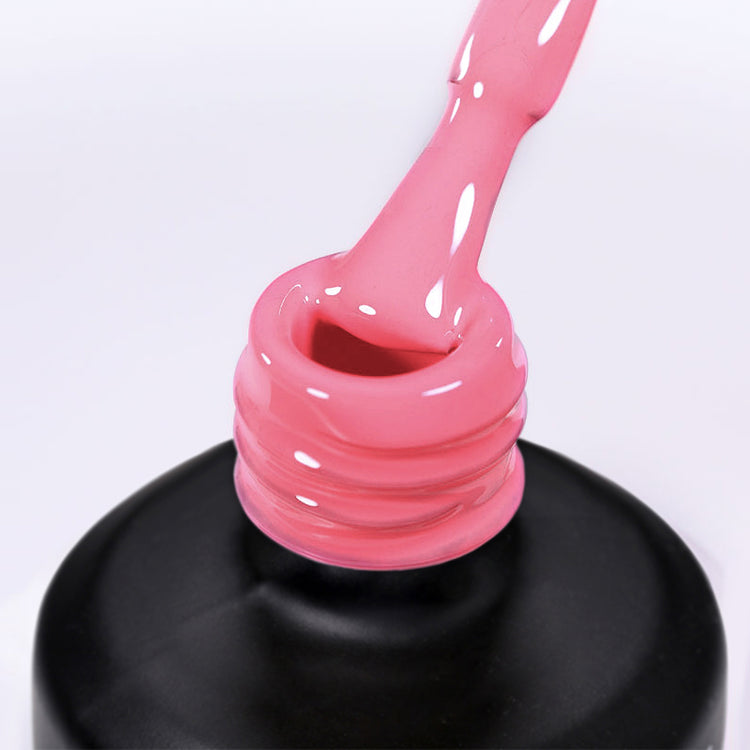 Nail Success Australia gel polish C081 in a warm rose pink, a close-up of the brush lifting from the bottle neck showing the creamy colour
