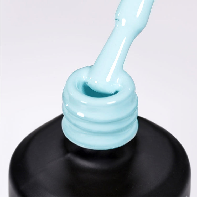 Nail Success Australia gel polish C091 in a pastel baby blue, a close-up of the brush lifting from the bottle neck showing the creamy colour