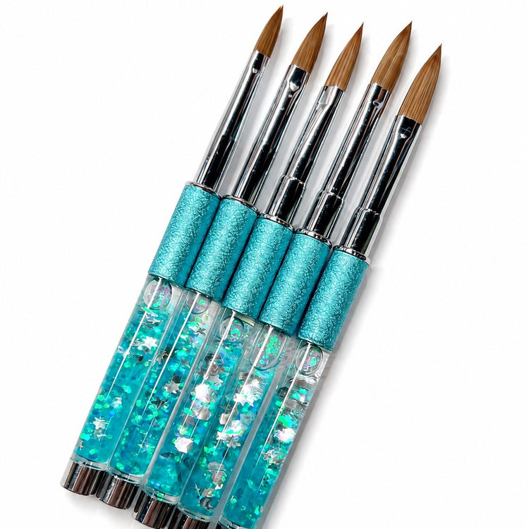 Acrylic nail brush set with blue glitter crystal handles, turquoise textured grips, silver ferrules and pointed brown bristles for professional acrylic nail application