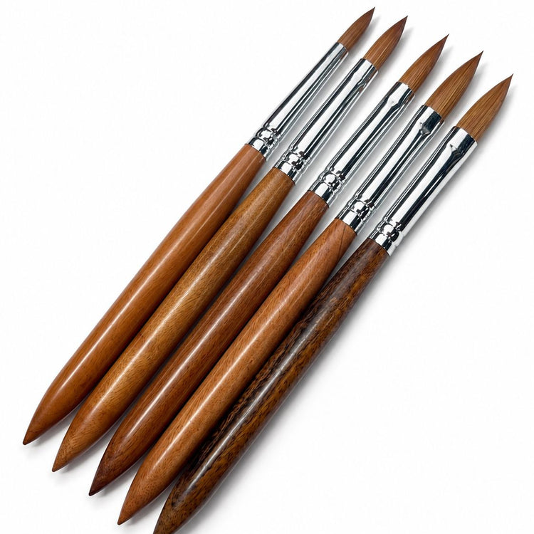 Acrylic nail brush set with brown wooden handles, silver ferrules and pointed brown bristles for professional acrylic nail application