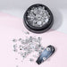 NSI Australia silver half-beads for nail art — mixed-size metallic dome studs in jar with sample nail tip