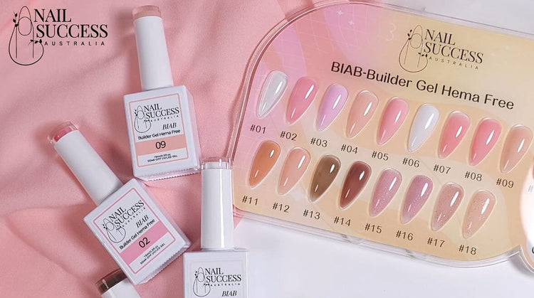 Nail Success BIAB Builder Gel HEMA-Free—18-colour swatch board with product bottles on pink fabric
