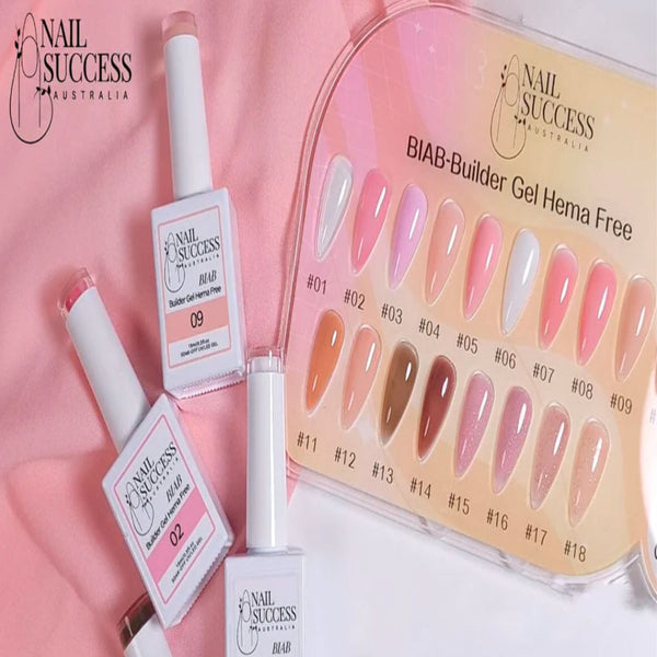 Nail Success BIAB Builder Gel HEMA-Free—18-colour swatch board with bottles (02 & 09) on pink fabric