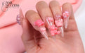 Clear stiletto nails with pink 3D gummy-bear gel accents and glitter — Nail Success Australia
