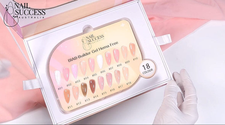Nail Success BIAB Builder Gel HEMA-Free—18-colour swatch board in presentation box with gloved hand