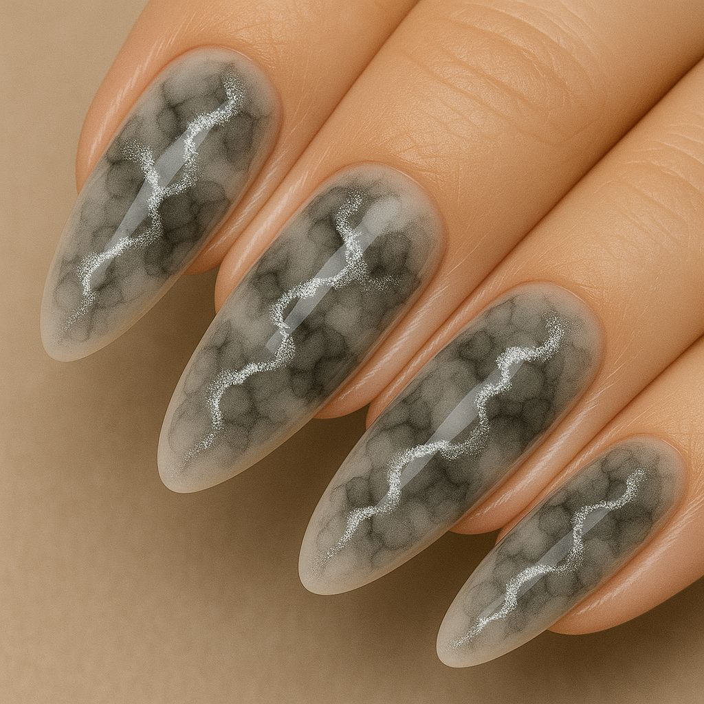NSI Blooming Gel smoke-marble almond nails with silver metallic kintsugi veins — glossy black-grey nail art close-up on hand