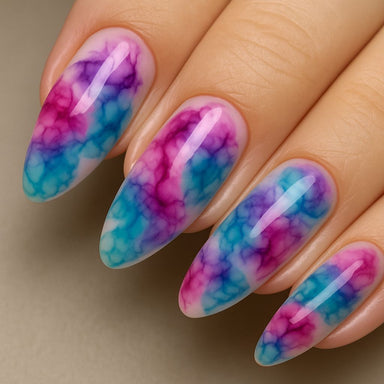 NSI Blooming Gel watercolor marble almond nails — glossy pink, purple and teal gradient smoke effect close-up on hand