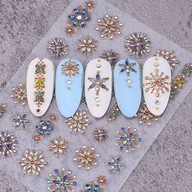 Bohemian 5D gemstone embossed nail art stickers with blue and gold floral designs on sample nail tips for luxury salon manicure decorations