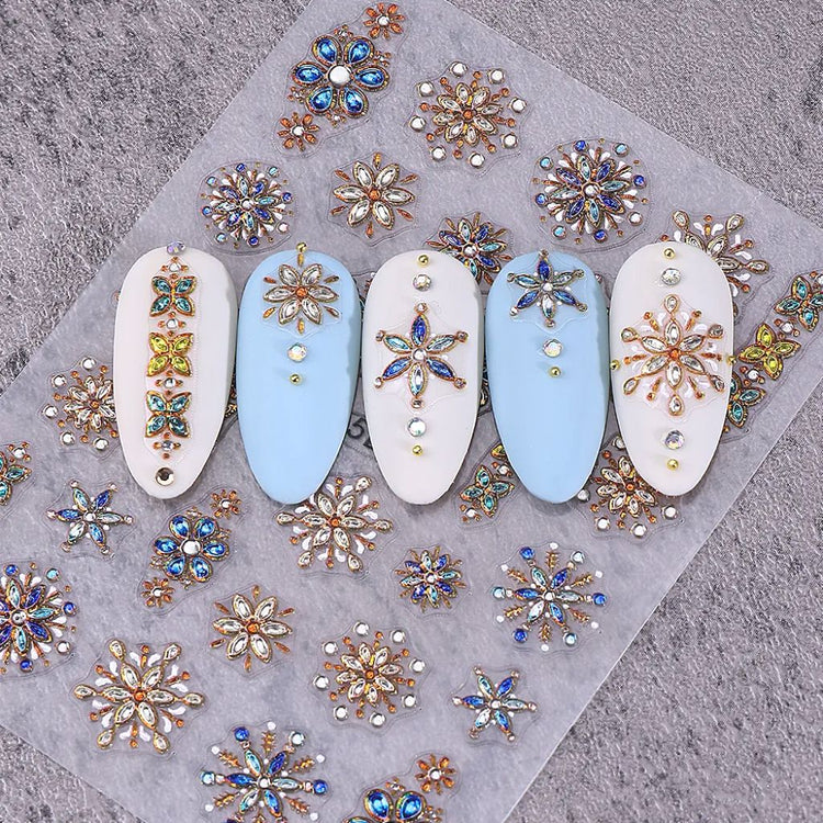 Bohemian 5D gemstone embossed nail art stickers with blue and gold floral designs on sample nail tips for luxury salon manicure decorations