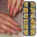 Gold nail art charms set in clear compartment tray, shown with nude pink nails decorated with 3D gold bows and rhinestones