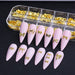 Gold bow nail art charms in organizer tray on pink stiletto nail tips, 3D metal bow decorations