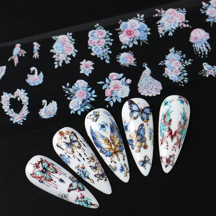 Floral and butterfly nail transfer foil — roses, birds and butterfly designs shown on white nail tips