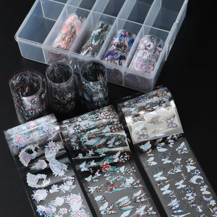Butterfly and floral nail transfer foil set (10 rolls) — assorted holographic foil rolls with sample sheets in organiser box