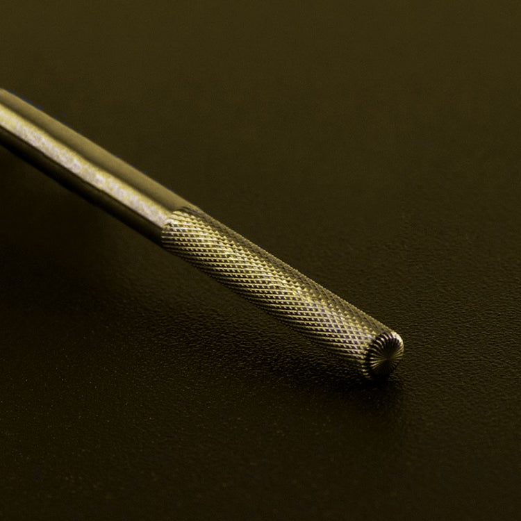 Gold tungsten carbide buffer nail drill bit close-up for acrylic gel removal, smoothing and professional manicure filing