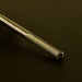 Gold tungsten carbide buffer nail drill bit close-up for acrylic gel removal, smoothing and professional manicure filing