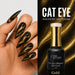 Black cat eye magnetic gel polish shown in use on a hand with long stiletto nails and paired with a matching bottle on a gold shimmer background labeled Gold