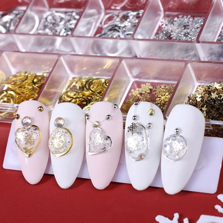 Christmas 3D nail charms and glitter mix — gold and silver rings, snowflakes and embellishments shown with sample nail tips