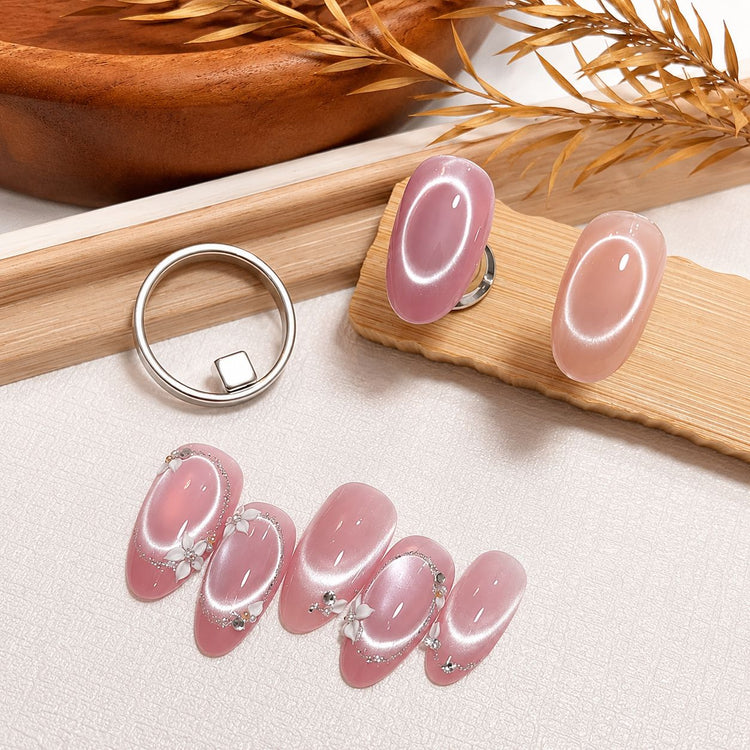 Circle halo cat eye magnet tool displayed with pink magnetic gel nail art tips, NSI Australia
