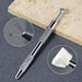 Stainless steel claw grabber tool with textured grip for holding mini cube sponges and nail art accessories