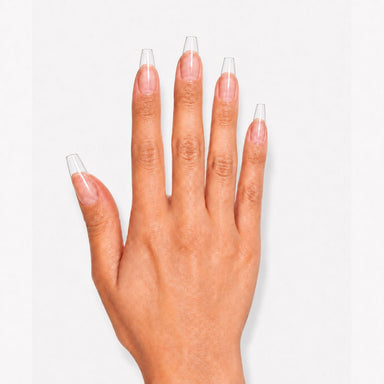 Clear coffin nail extension tips applied to natural nails, showing their tapered square shape and transparent finish