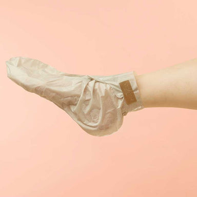Foot wearing Voesh collagen treatment sock with argan oil and floral extracts