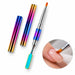 Rainbow double-ended gel brush and spatula tool with two matching protective caps, shown smoothing gel on a nude pink nail.