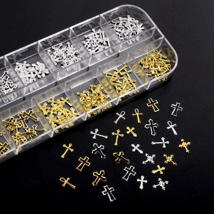 Gold and silver cross nail charms in organiser tray for 3D nail art decorations and salon manicure designs