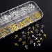 Gold and silver cross nail charms in organiser tray for 3D nail art decorations and salon manicure designs