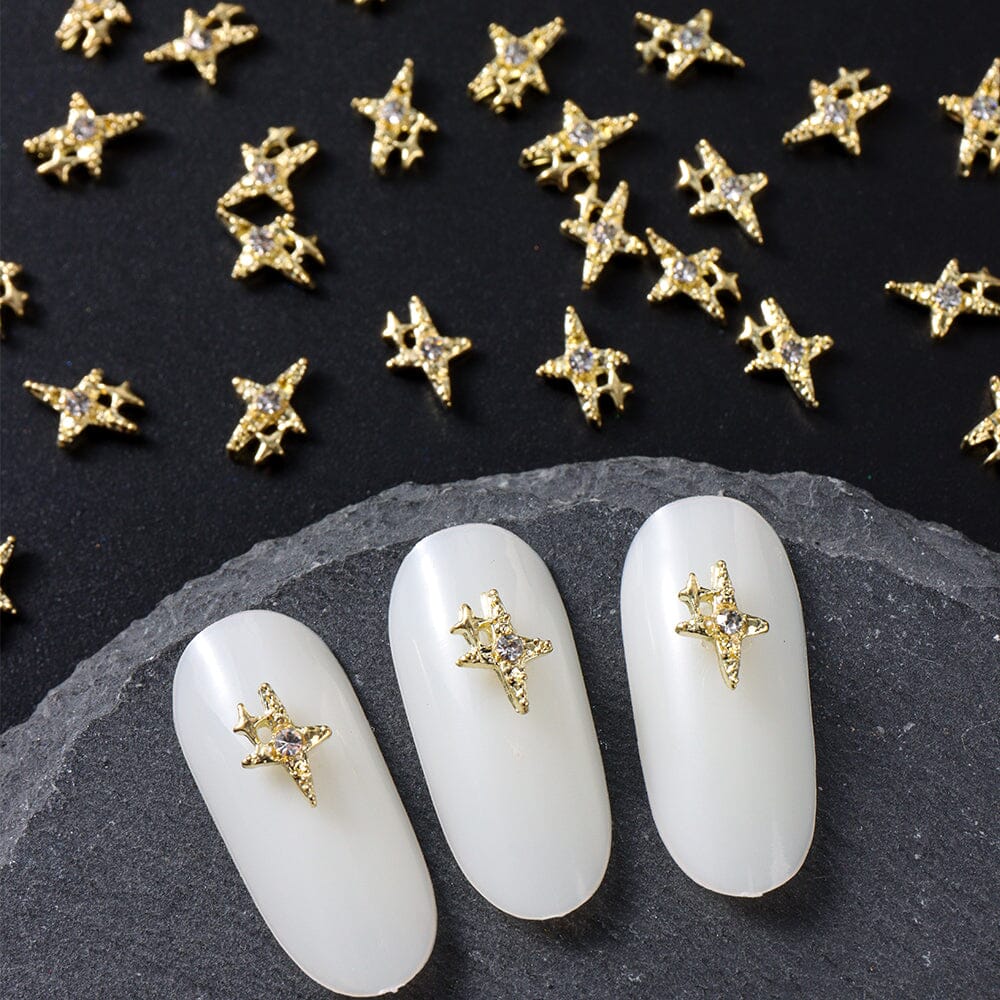 Nail Success Australia cross star rhinestone nail charms — gold 3D embellishments shown on white tips